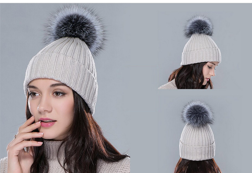 beige raccoon fur pom pom hat